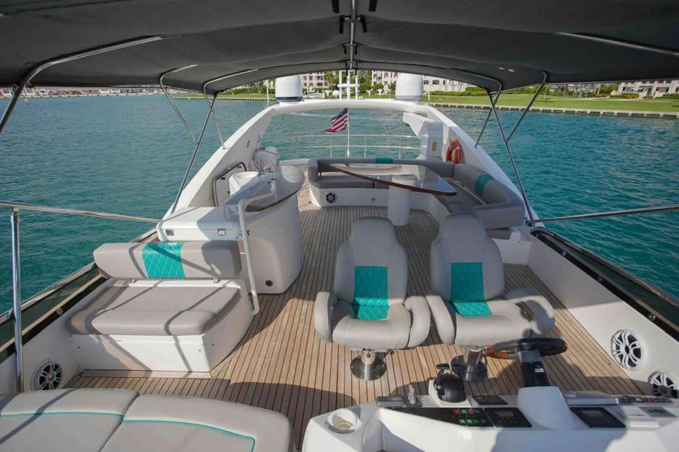 The flybridge offers a spacious and comfortable area for relaxation and navigation with stunning views of the surroundings. aboard 2006 SUNSEEKER MANHATTAN 'FINS UP' Yacht for Sale