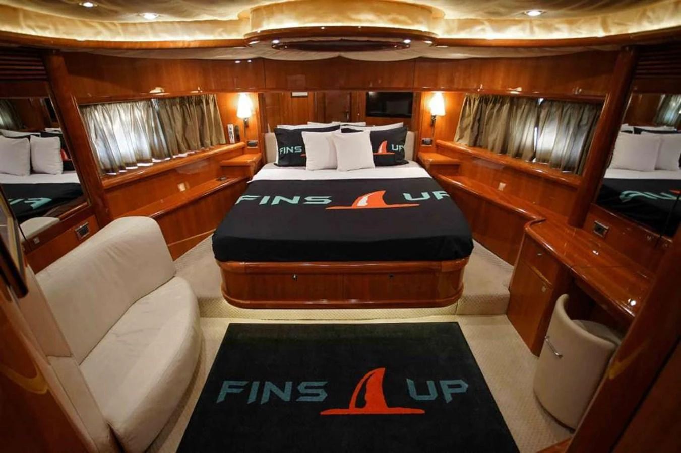The master stateroom features a luxurious bed with custom bedding and elegant wood finishes. aboard 2006 SUNSEEKER MANHATTAN 'FINS UP' Yacht for Sale
