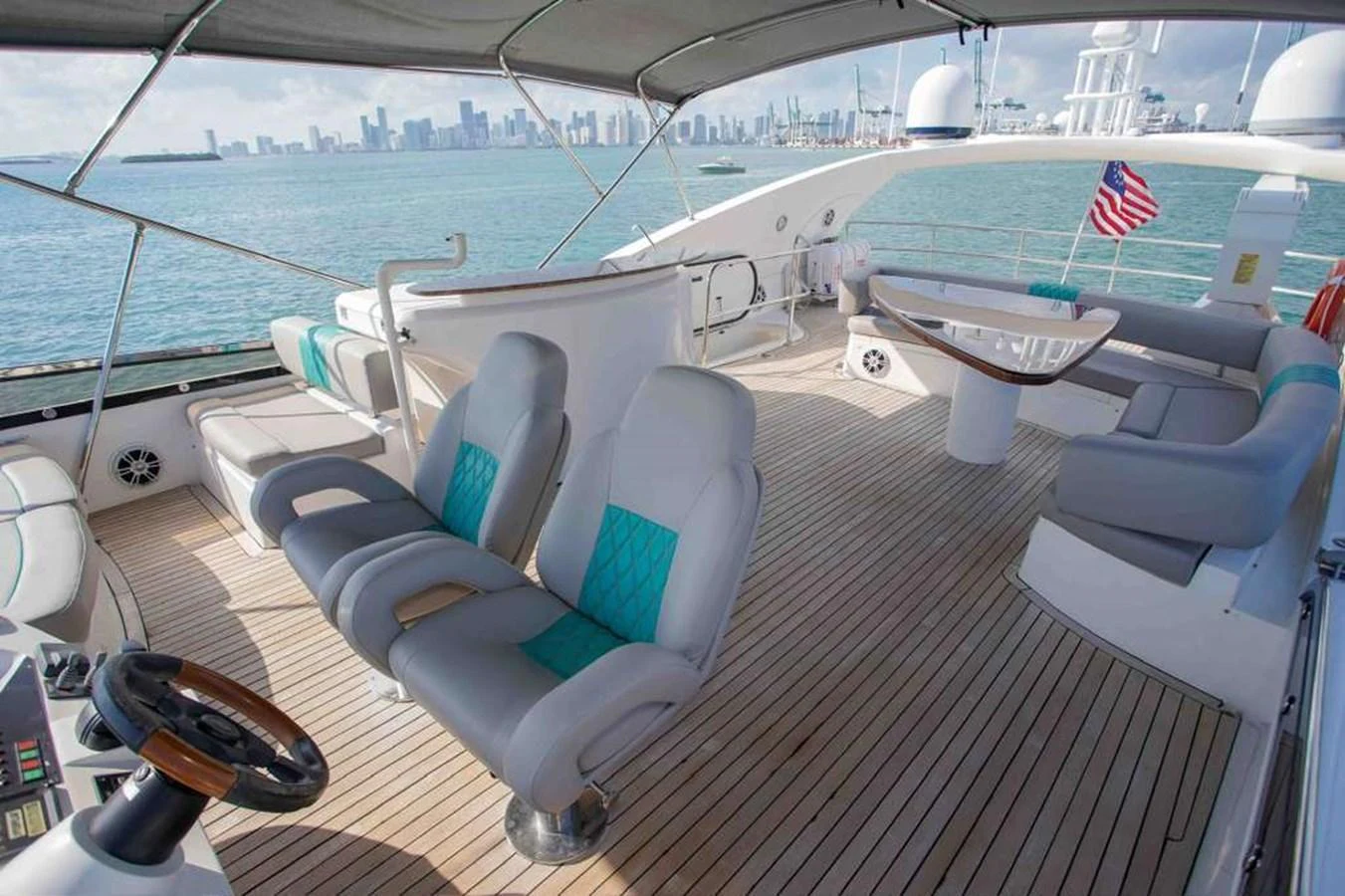 The flybridge offers a spacious and comfortable area with ample seating and stunning views of the surrounding waters. aboard 2006 SUNSEEKER MANHATTAN 'FINS UP' Yacht for Sale