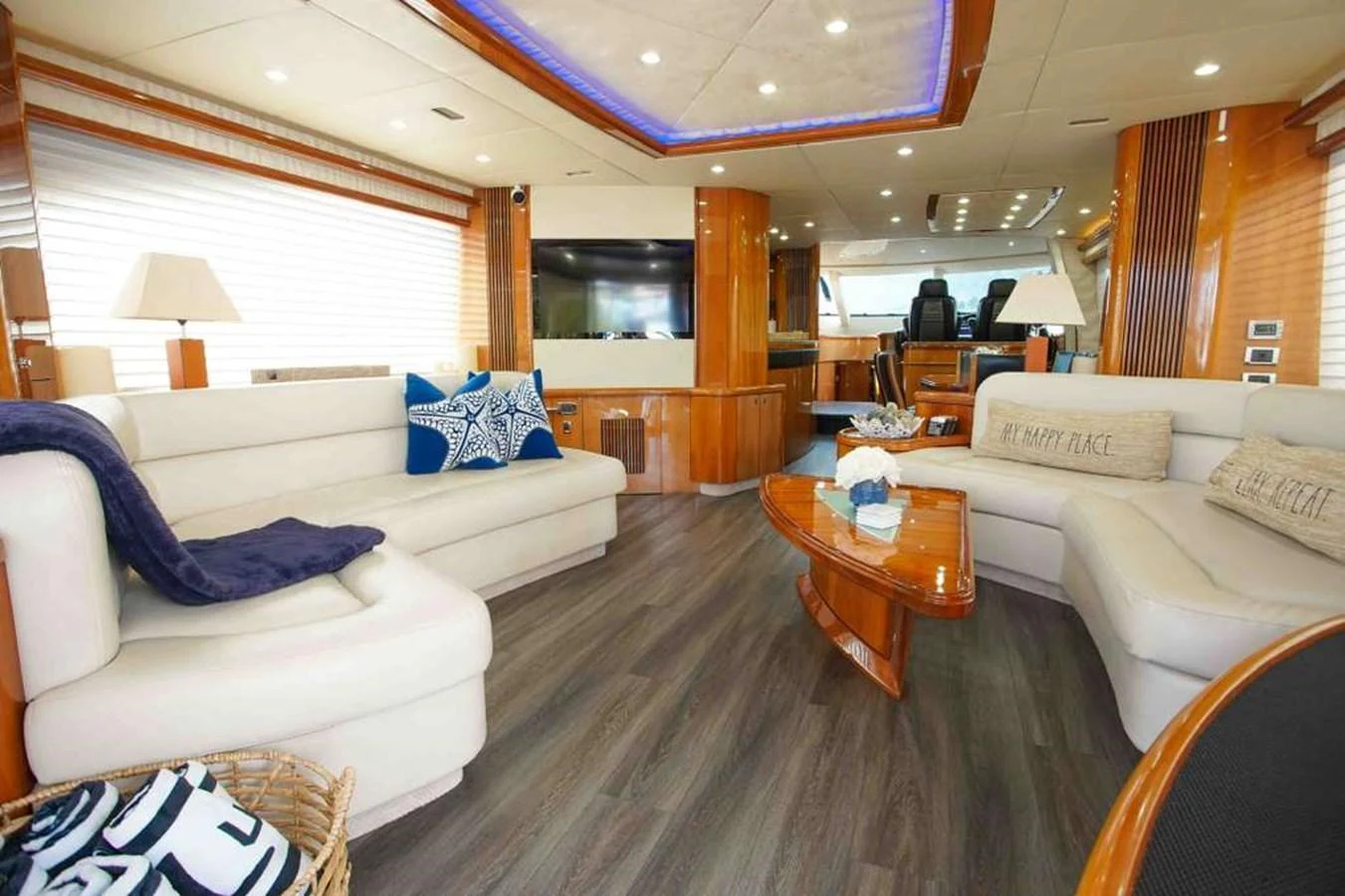 The salon features plush seating, a modern entertainment system, and elegant decor. aboard 2006 SUNSEEKER MANHATTAN 'FINS UP' Yacht for Sale