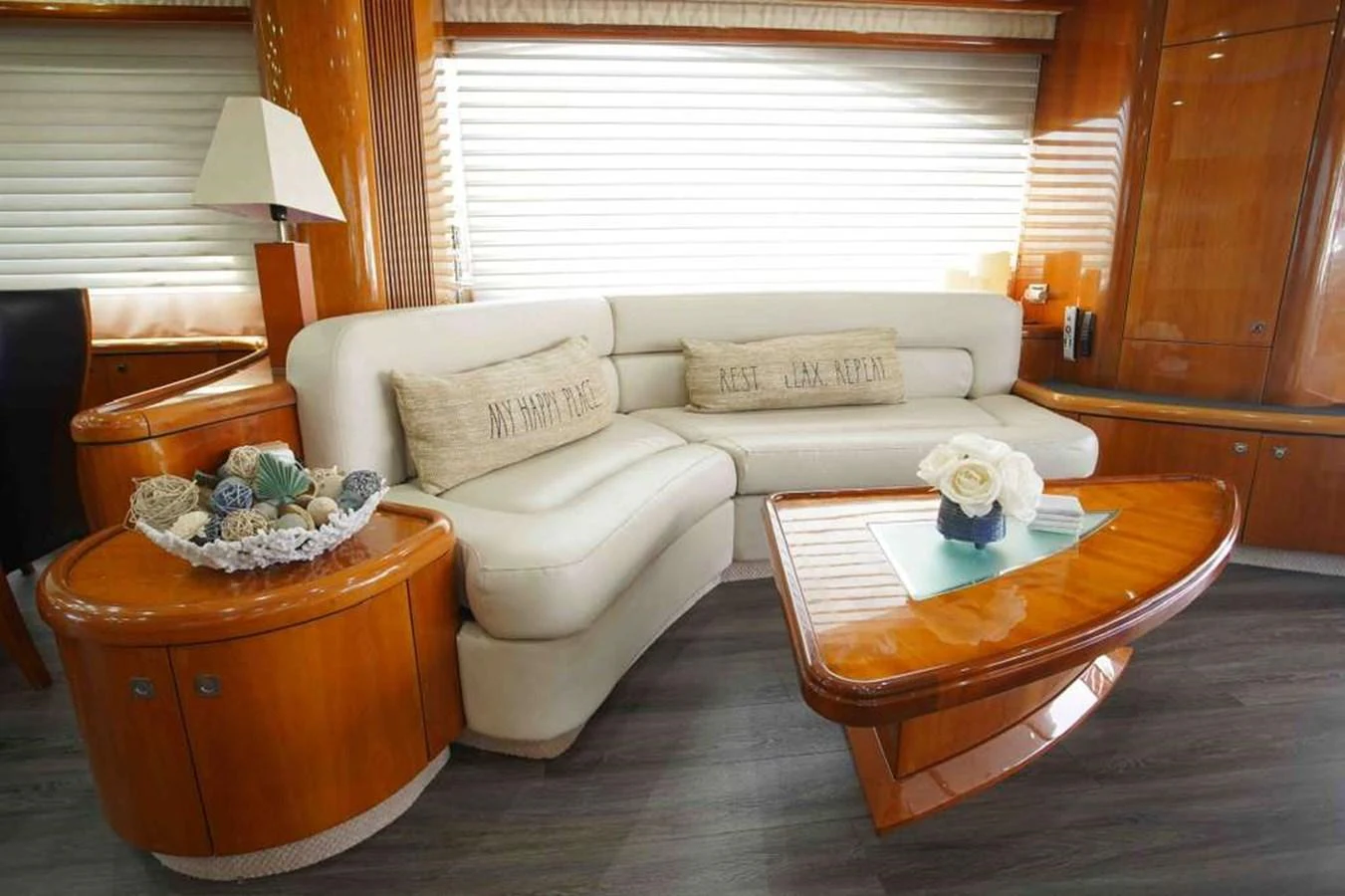 The salon features a luxurious seating area with elegant wooden accents and plush cushions. aboard 2006 SUNSEEKER MANHATTAN 'FINS UP' Yacht for Sale