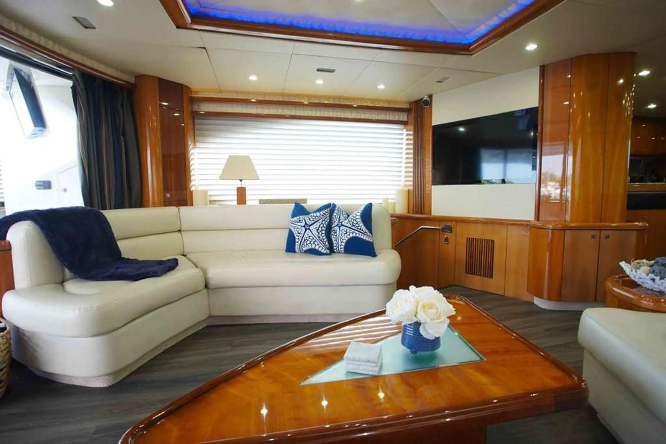 The salon features luxurious seating with elegant decor and ample natural light. aboard 2006 SUNSEEKER MANHATTAN 'FINS UP' Yacht for Sale