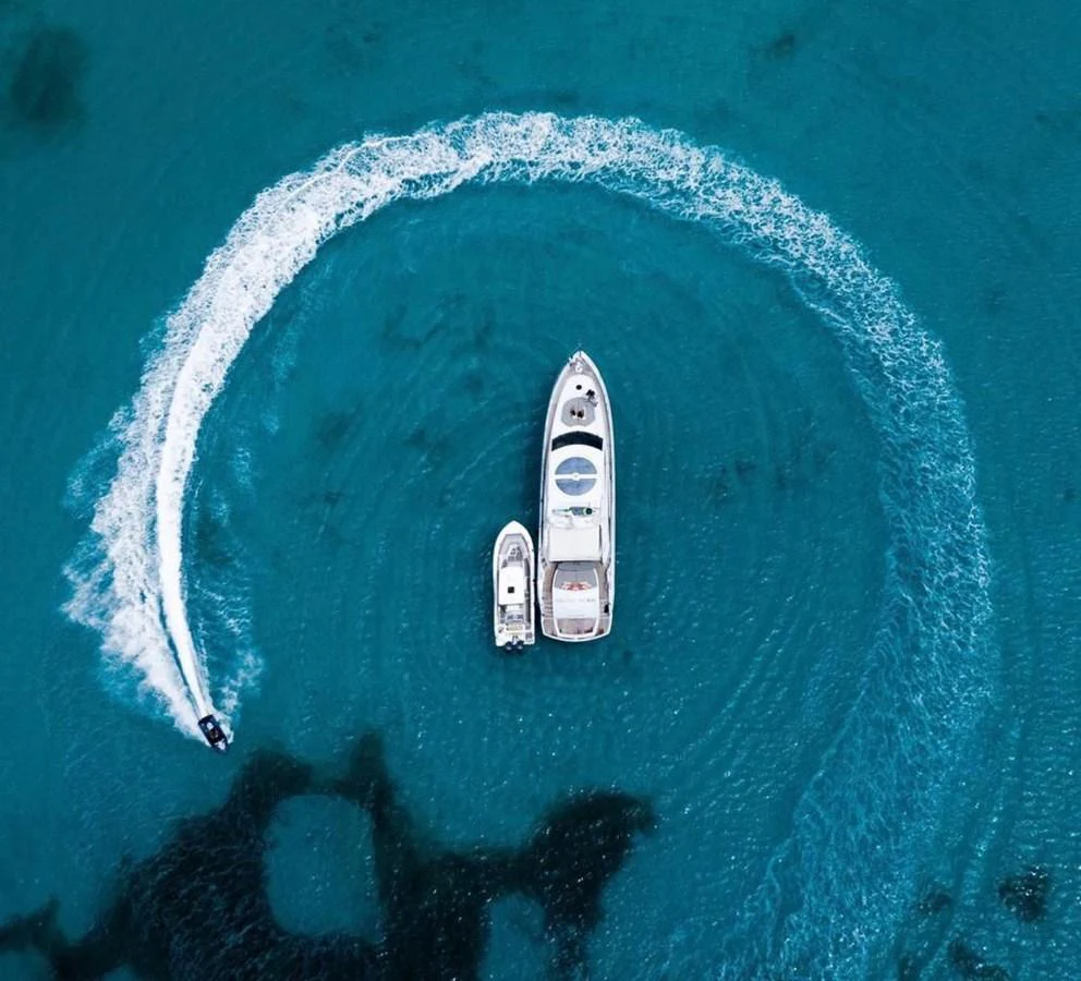 a plane flying over a planet aboard GBXSK03391E506 Yacht for Sale
