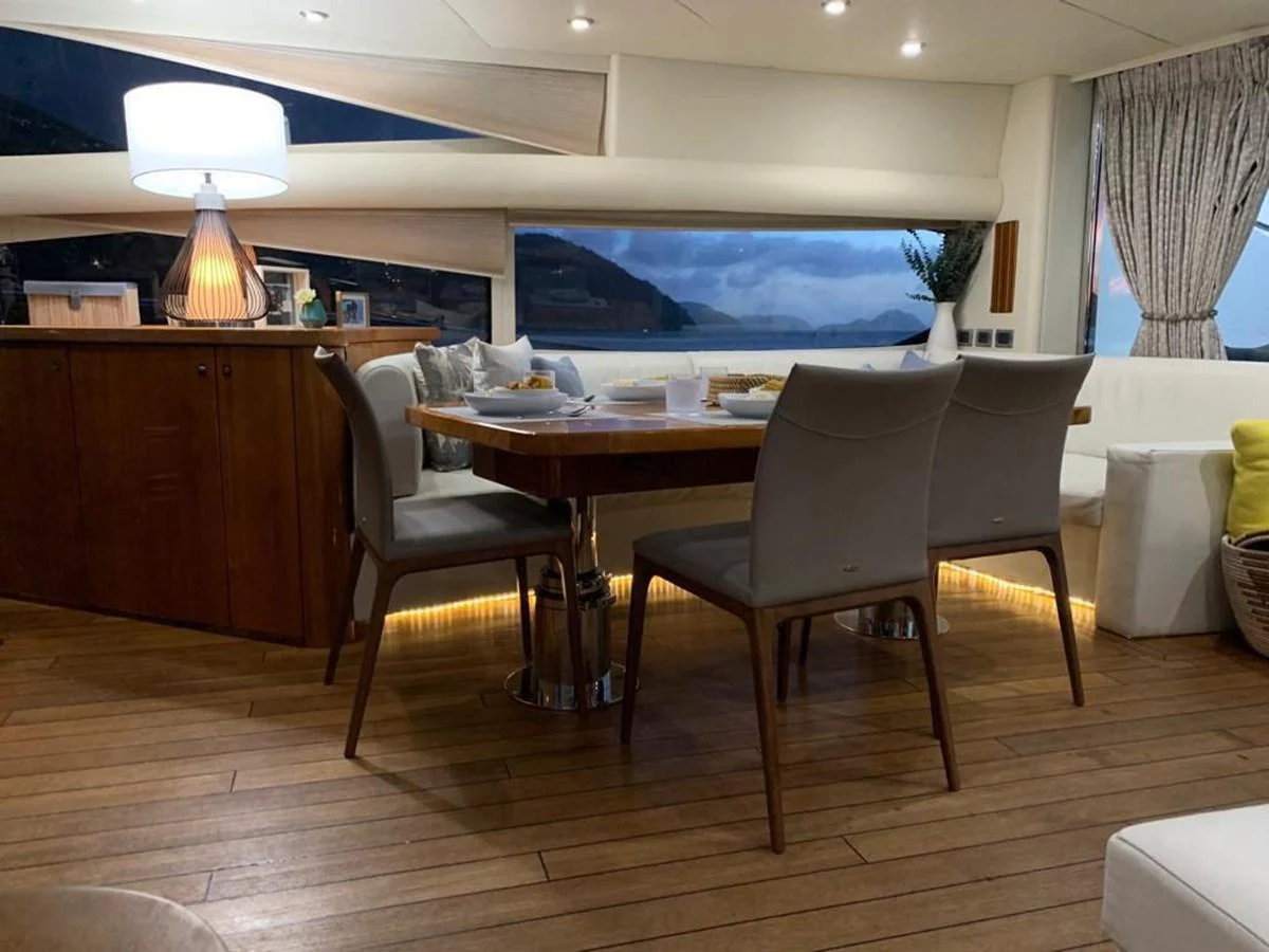 a room with a table and chairs aboard GBXSK03391E506 Yacht for Sale
