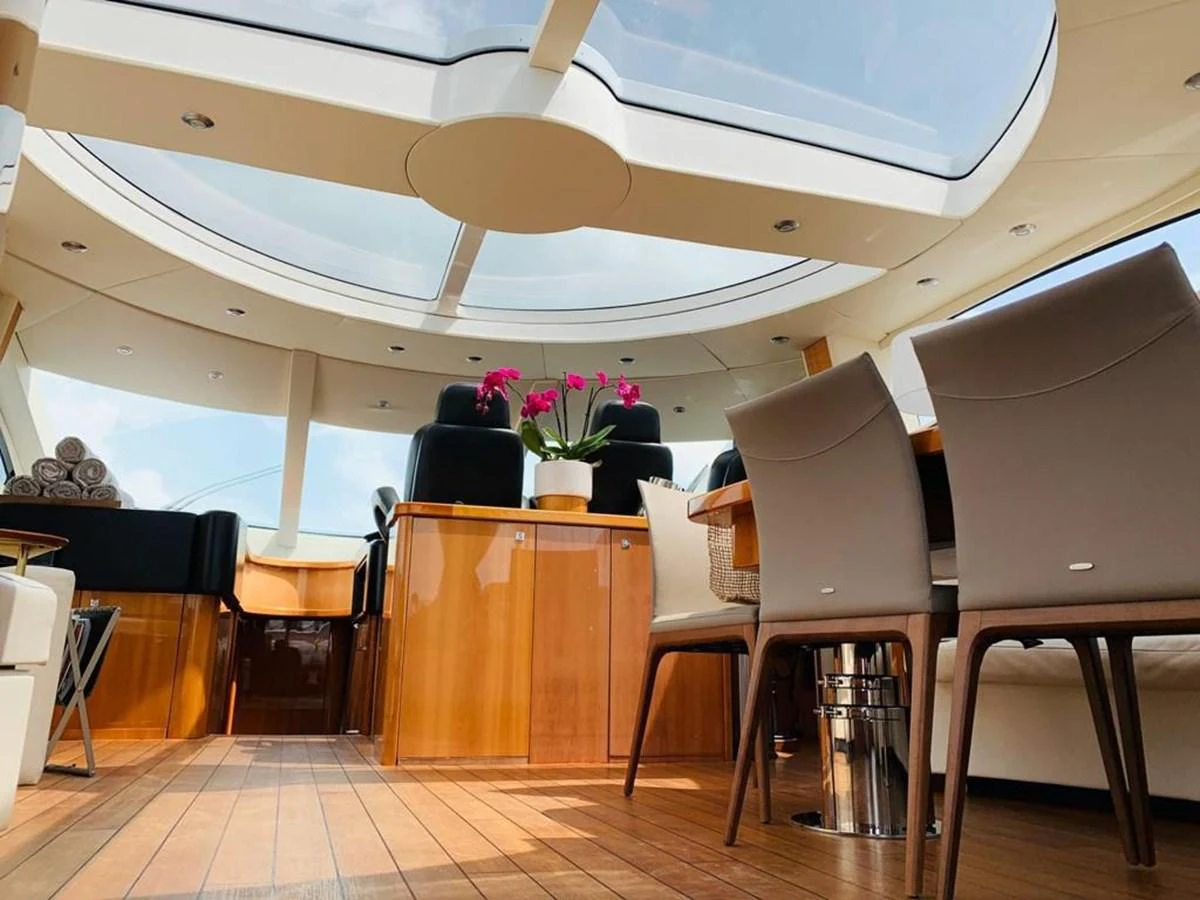 a room with chairs and tables aboard GBXSK03391E506 Yacht for Sale
