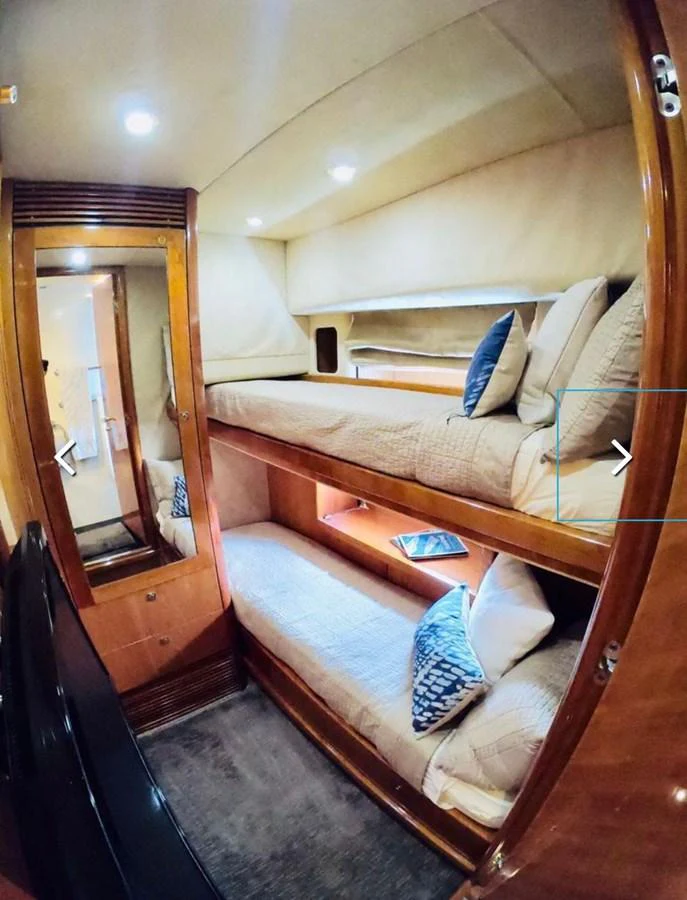 a bed with a blue pillow aboard GBXSK03391E506 Yacht for Sale