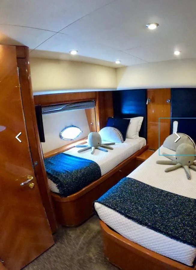 a room with a bed and a mirror aboard GBXSK03391E506 Yacht for Sale
