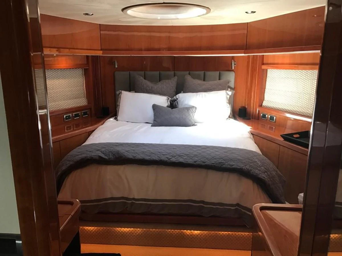 a bed with white sheets aboard GBXSK03391E506 Yacht for Sale