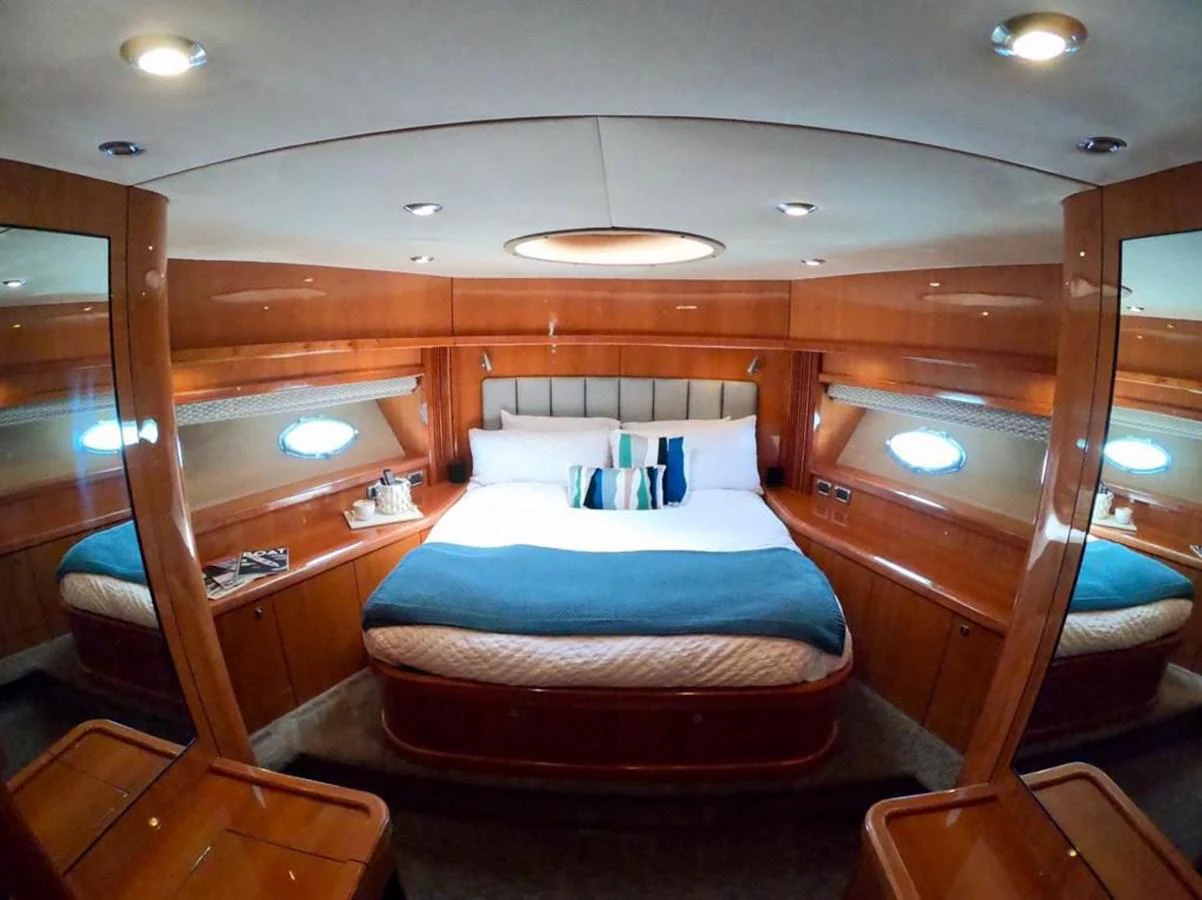 a bedroom with a bed and a desk aboard GBXSK03391E506 Yacht for Sale