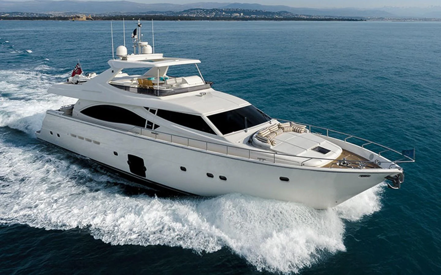 A sleek and modern yacht cruising on the open water, showcasing its elegant design and spacious deck. aboard ONYX Yacht for Sale