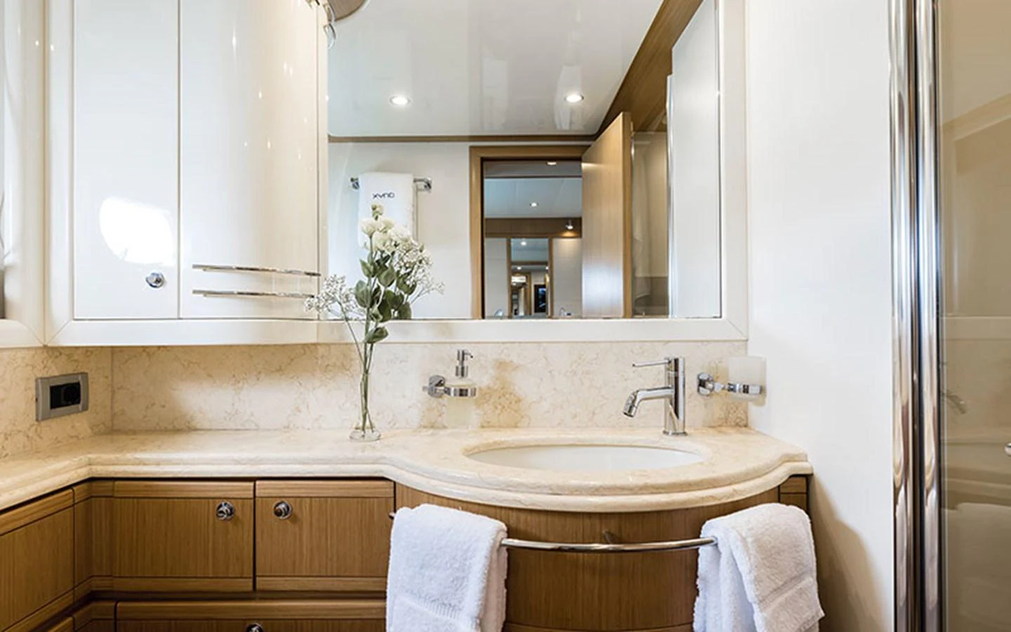 The yacht's bathroom features elegant fixtures and a luxurious marble countertop. aboard ONYX Yacht for Sale