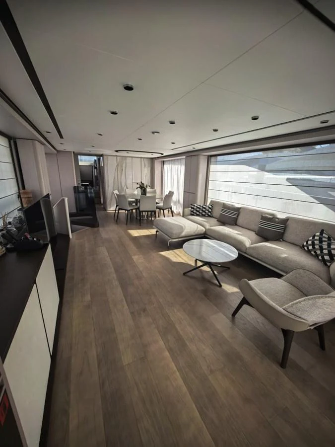 The yacht's salon features a spacious and modern seating area with elegant furnishings. aboard TBN 860 Yacht for Sale