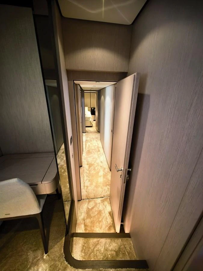 A narrow hallway with modern design and elegant finishes. aboard TBN 860 Yacht for Sale