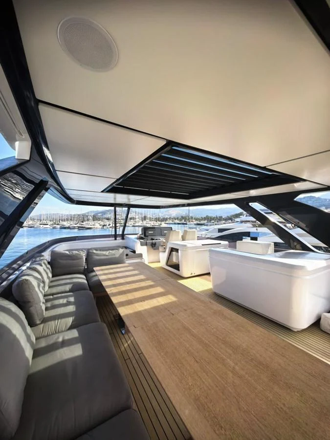 The flybridge offers a spacious and luxurious area with comfortable seating and modern amenities. aboard TBN 860 Yacht for Sale