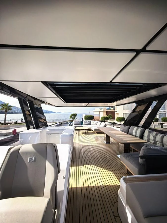 The aft deck offers a spacious and comfortable seating area with a view of the water. aboard TBN 860 Yacht for Sale