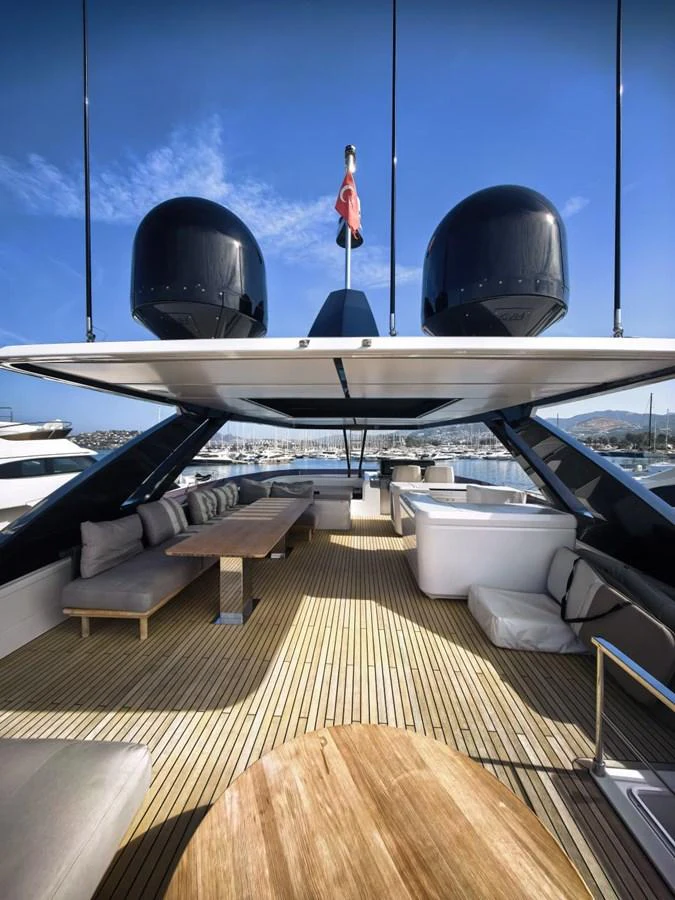 The flybridge offers a spacious and luxurious outdoor seating area with ample shade and scenic views. aboard TBN 860 Yacht for Sale