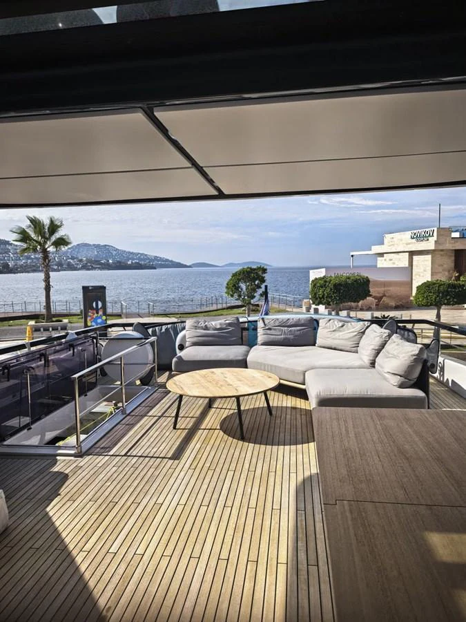 The aft deck offers a spacious seating area with a stunning view of the sea. aboard TBN 860 Yacht for Sale