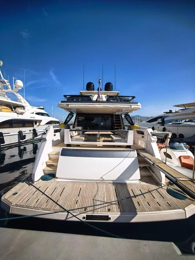 The yacht's aft deck features a spacious area with steps leading up to the main deck, showcasing a luxurious and inviting design. aboard TBN 860 Yacht for Sale