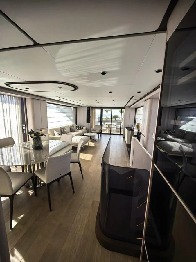 The yacht's salon features elegant furnishings and ample natural light, creating a luxurious and inviting atmosphere. aboard TBN 860 Yacht for Sale