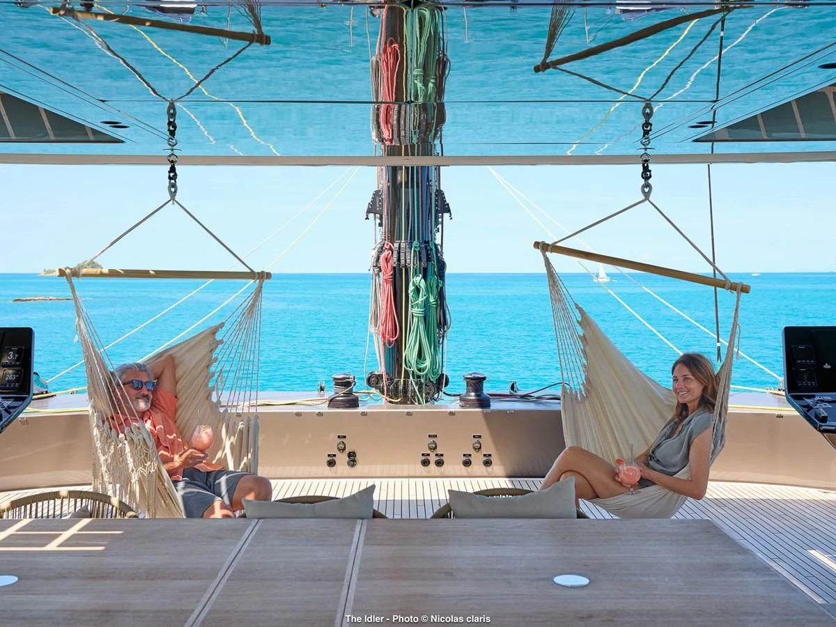 The aft deck features comfortable hammock seating with a stunning ocean view. aboard THE IDLER Yacht for Sale