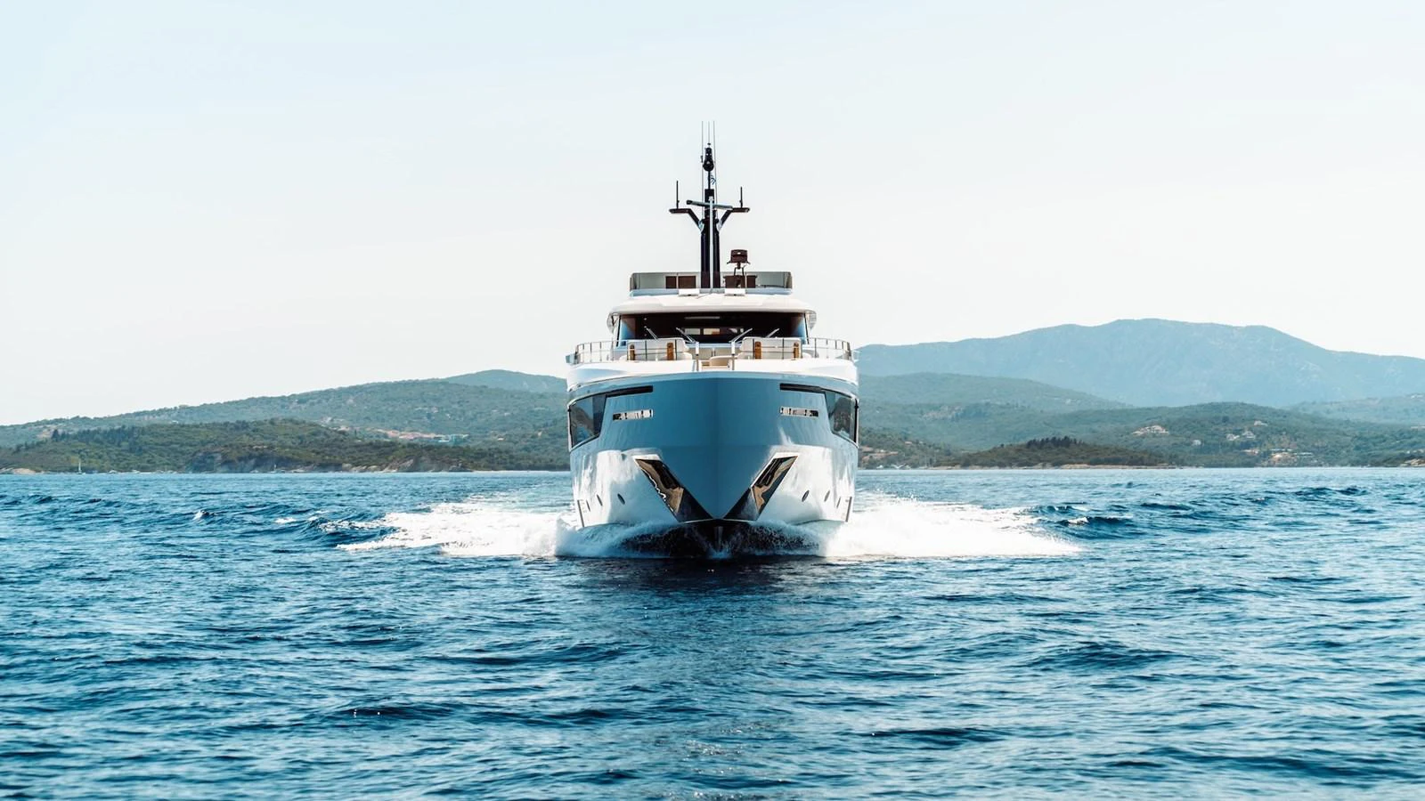 A sleek and modern yacht cruises through the open water, showcasing its impressive design. aboard AT ONE Yacht for Sale