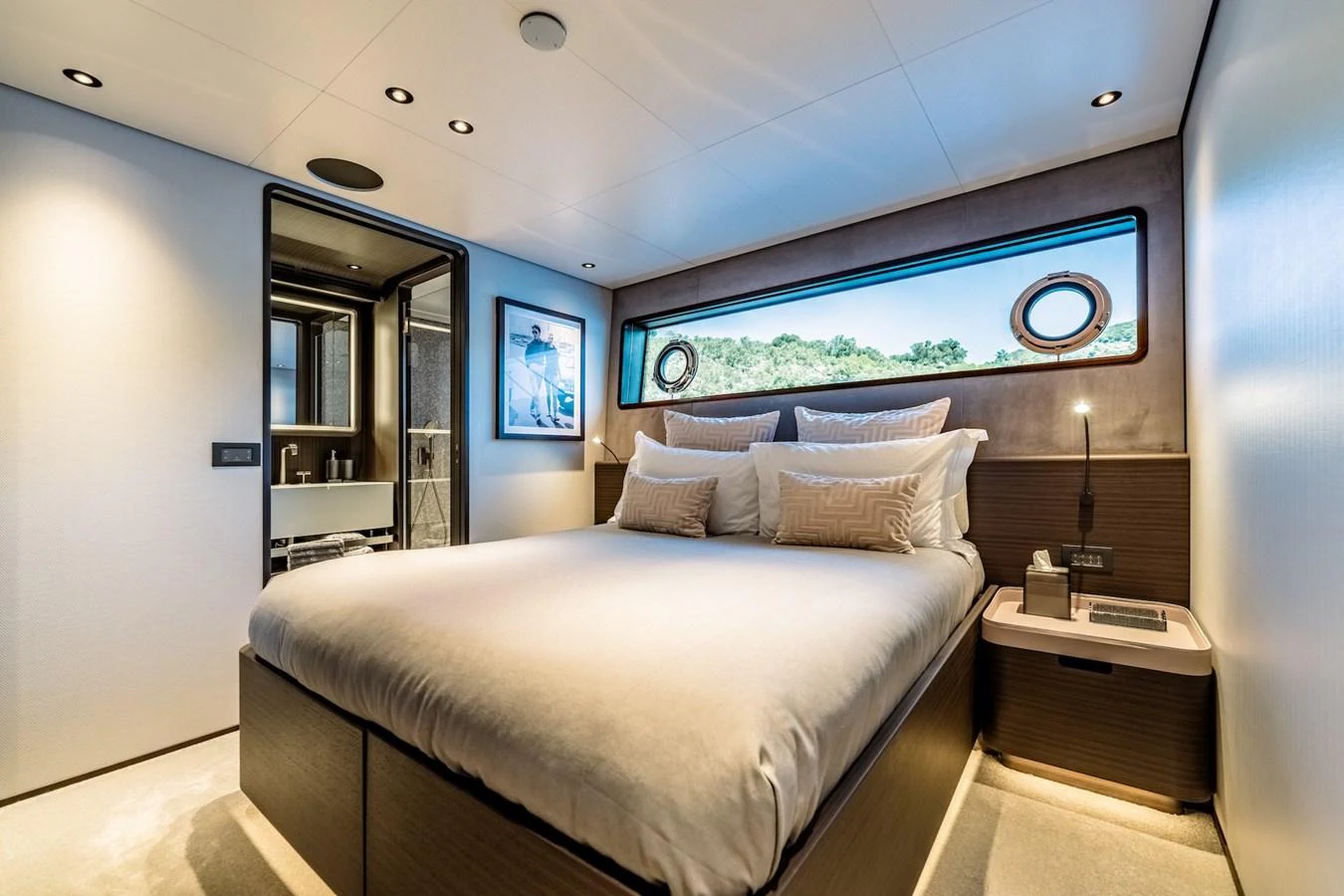 A luxurious stateroom with a large bed and modern decor. aboard AT ONE Yacht for Sale