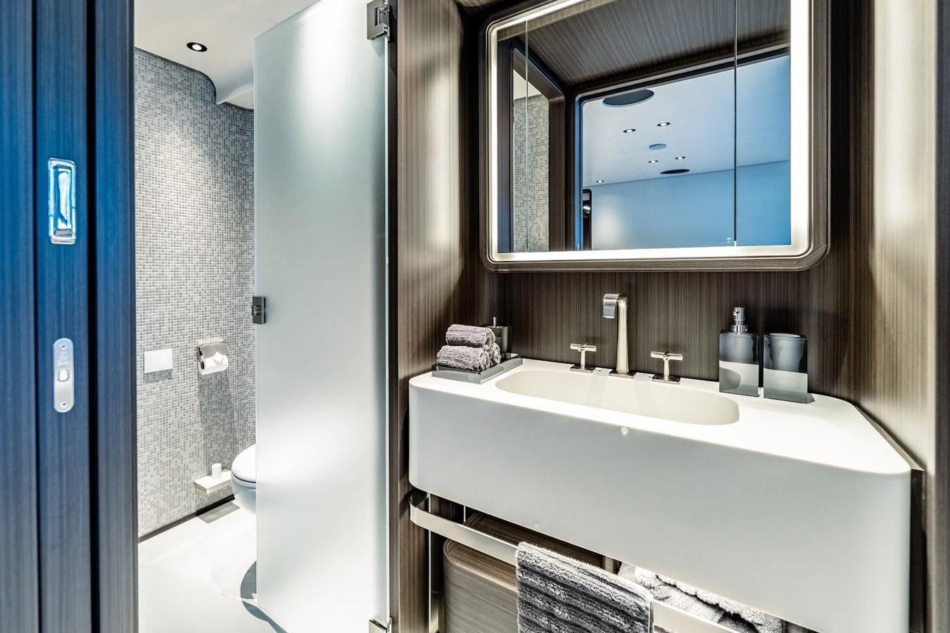 The yacht's bathroom features modern fixtures and a sleek design. aboard AT ONE Yacht for Sale