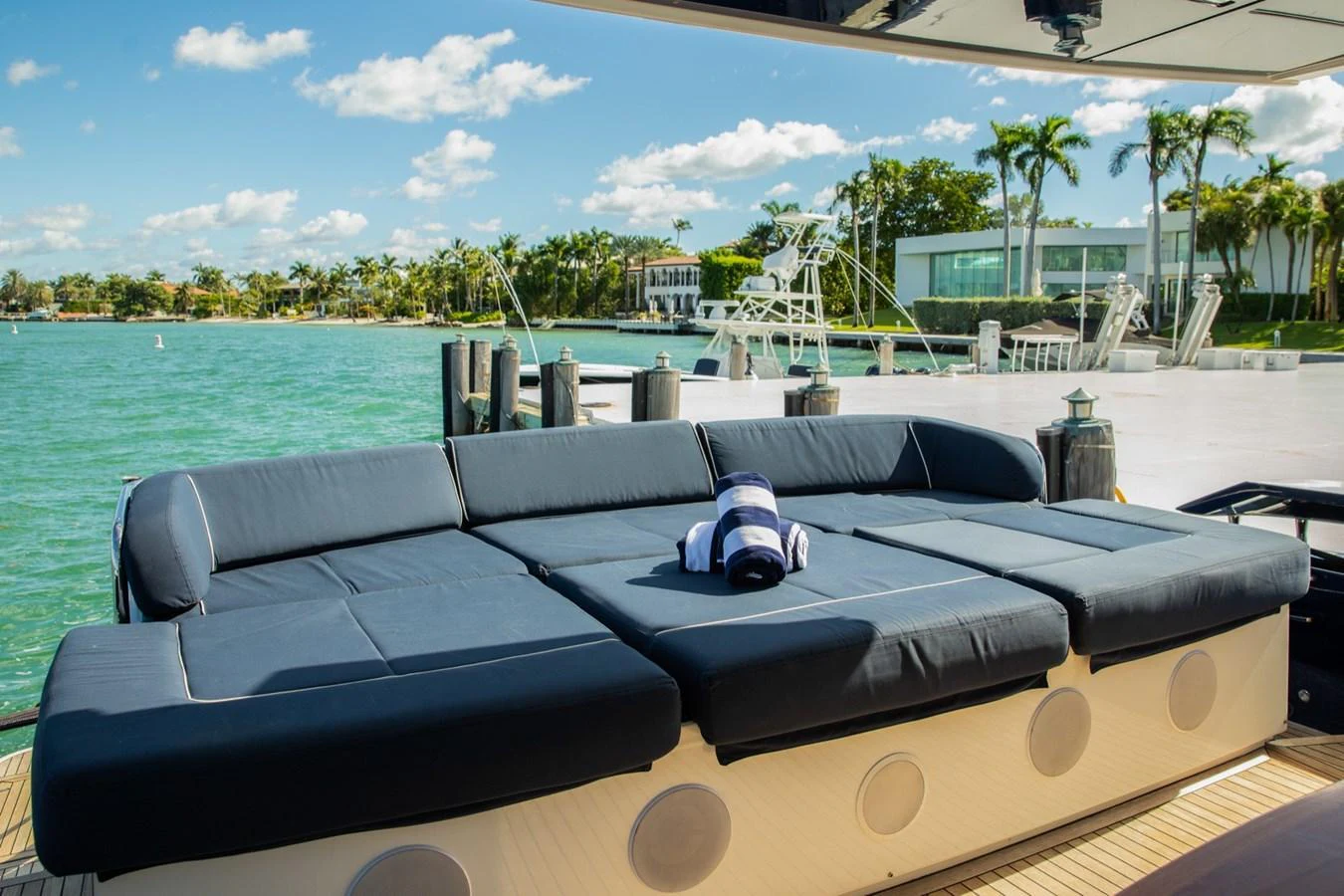 The aft deck features a spacious sunbed with plush navy cushions, perfect for relaxation. aboard DOROTHY ANN Yacht for Sale