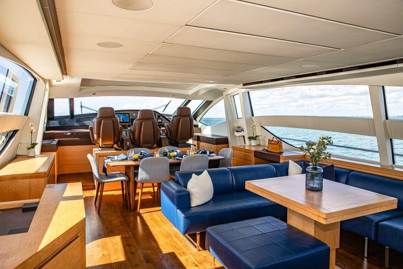 The yacht's salon features a spacious and elegant seating area with panoramic windows offering stunning views. aboard DOROTHY ANN Yacht for Sale