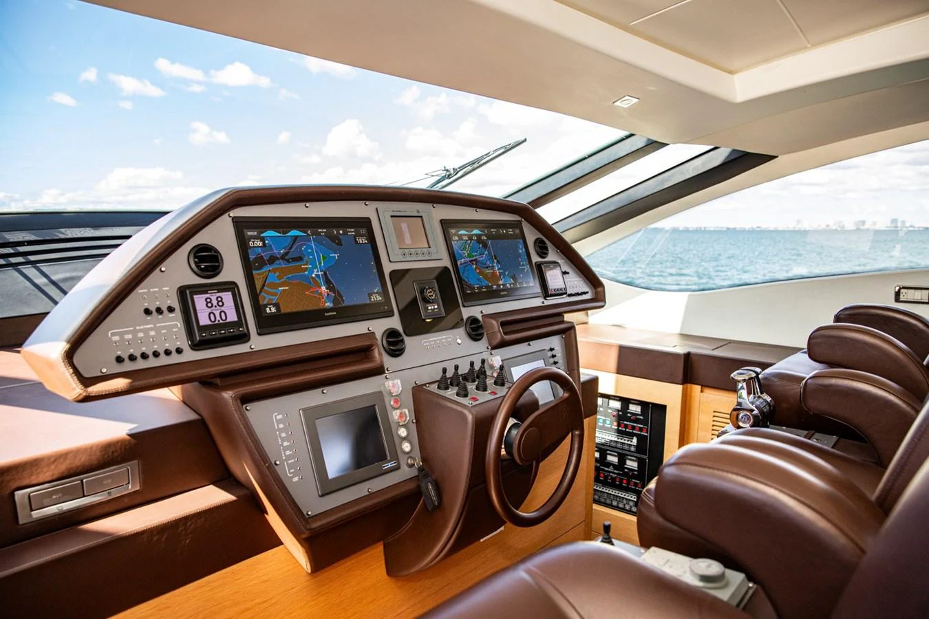 The helm station offers a sophisticated and technologically advanced control center with panoramic views. aboard DOROTHY ANN Yacht for Sale