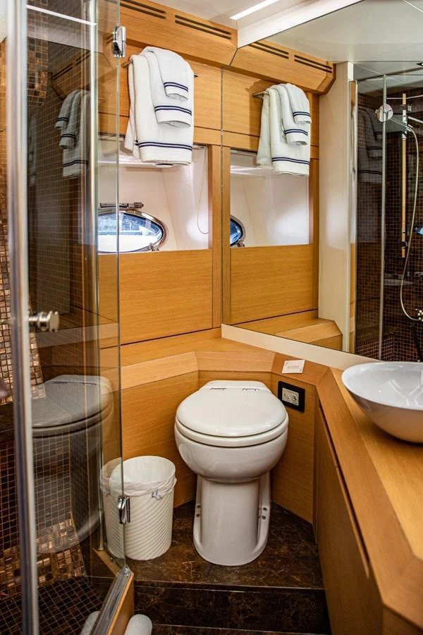 A well-appointed yacht bathroom featuring modern fixtures and ample storage. aboard DOROTHY ANN Yacht for Sale