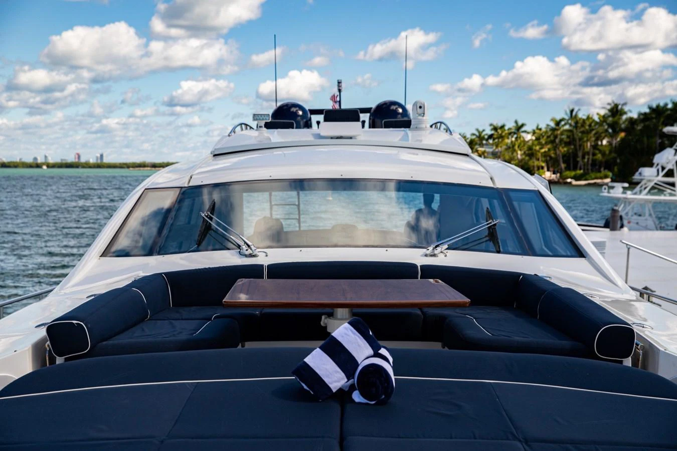 The yacht's aft deck offers a luxurious seating area with a table, perfect for enjoying the scenic views. aboard DOROTHY ANN Yacht for Sale