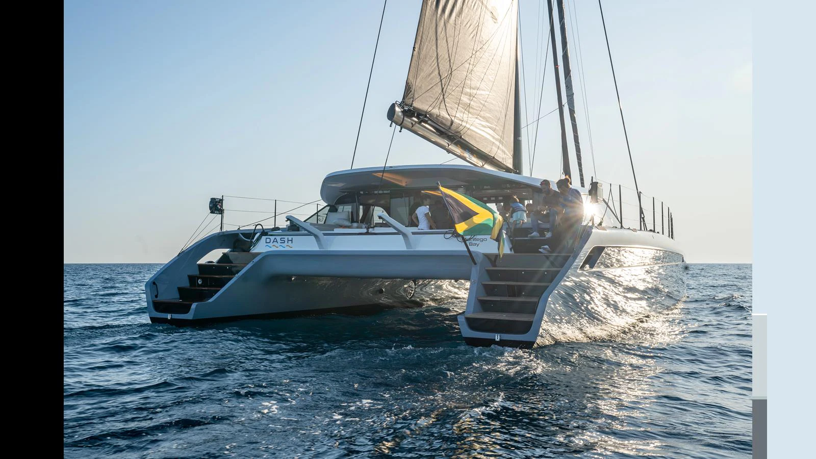 A sleek catamaran yacht sails gracefully on the open water, showcasing its modern design and spacious deck. aboard GUNBOAT 80 Yacht for Sale