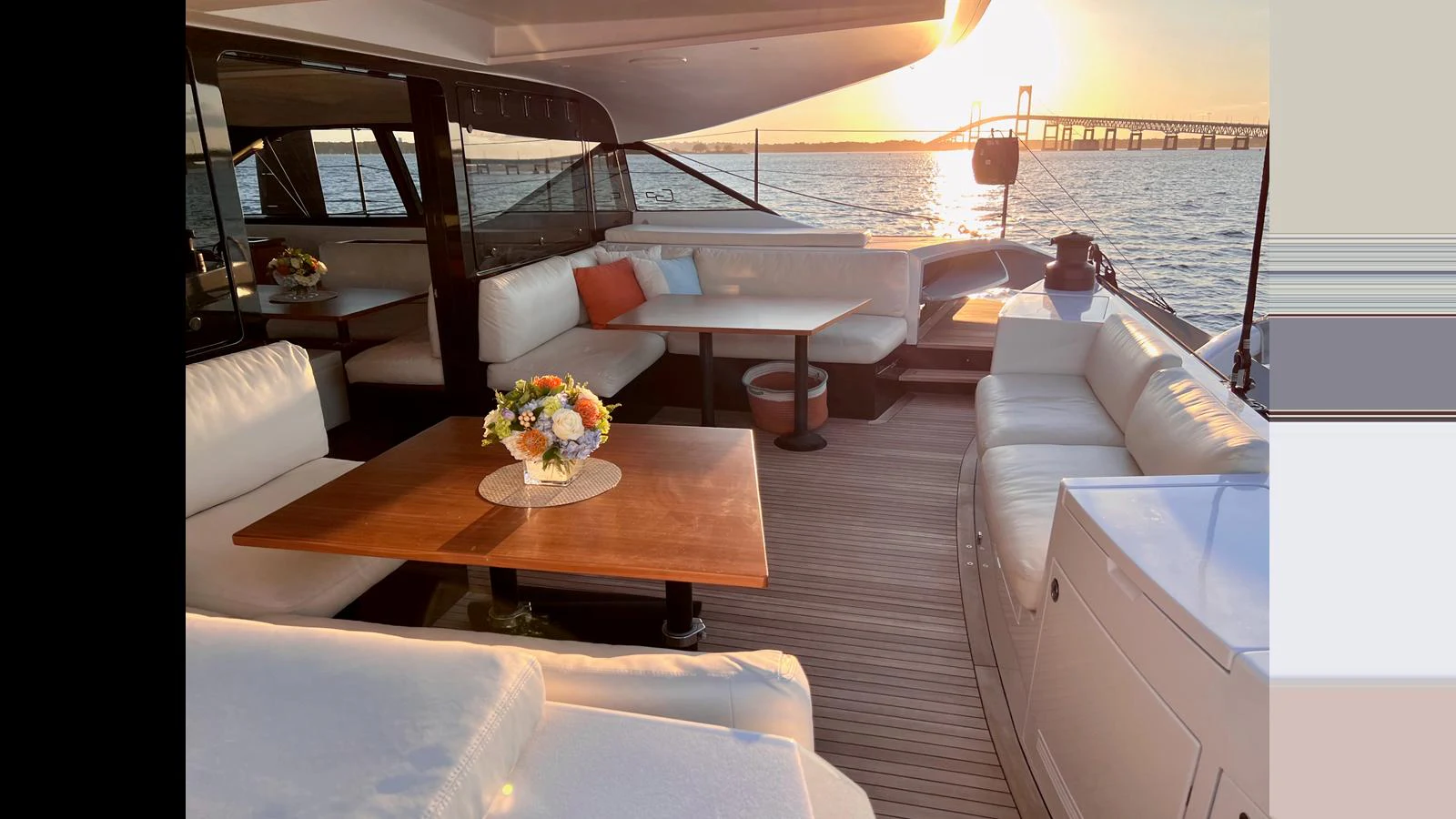 The aft deck features elegant seating with a stunning sunset view over the water. aboard GUNBOAT 80 Yacht for Sale