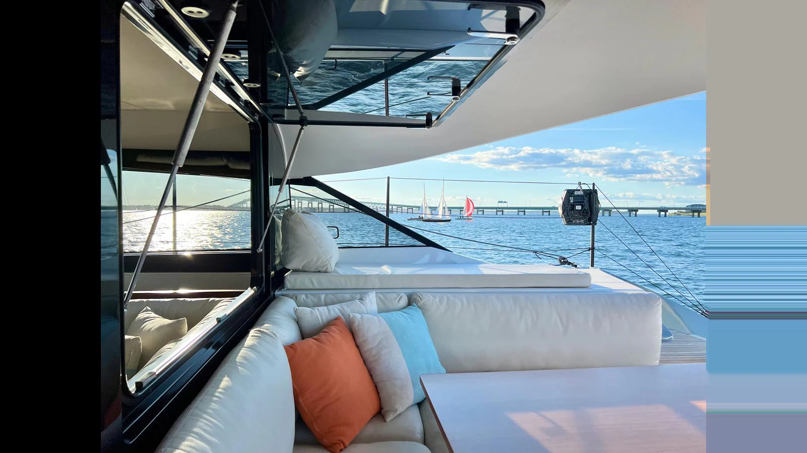 The aft deck offers a luxurious lounging area with plush seating and stunning views of the water. aboard GUNBOAT 80 Yacht for Sale