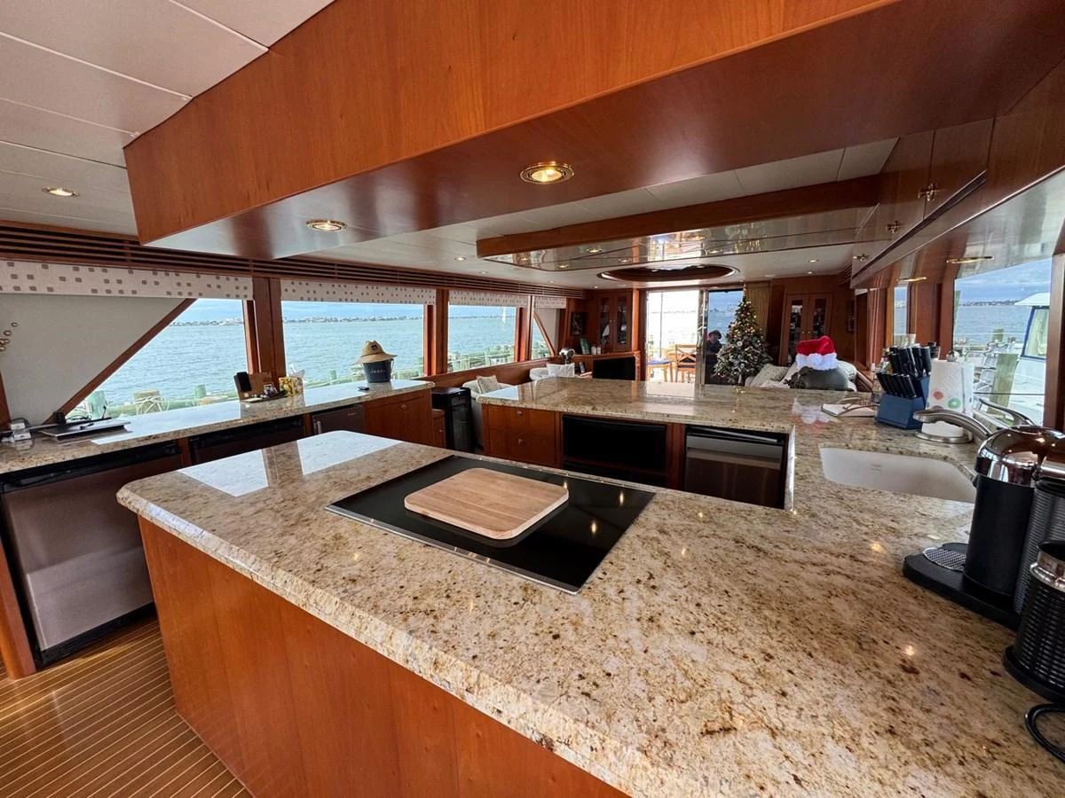 The galley features a spacious layout with modern appliances and a beautiful view of the water. aboard 68' HARGRAVE OPEN BRIDGE Yacht for Sale