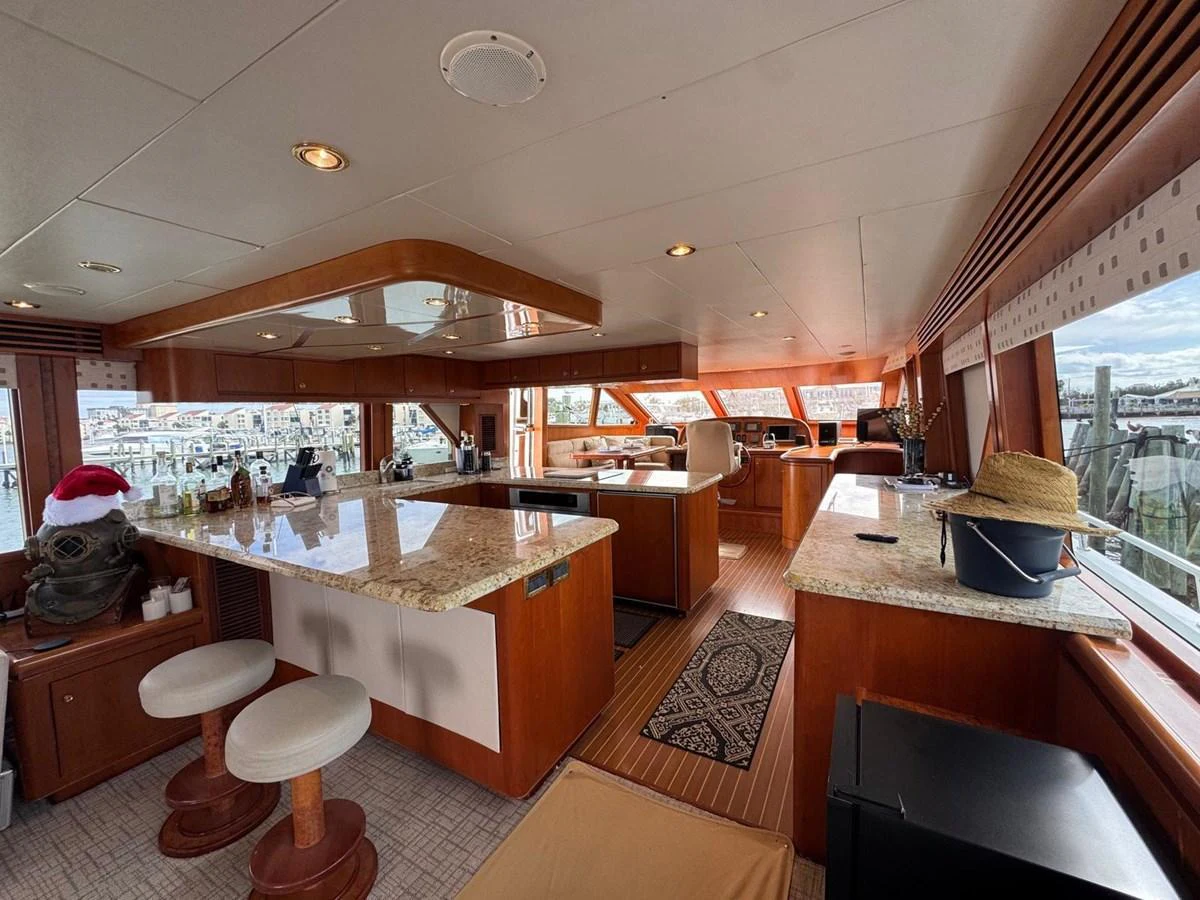 The yacht's galley features a spacious and well-equipped kitchen area with ample counter space and seating. aboard 68' HARGRAVE OPEN BRIDGE Yacht for Sale