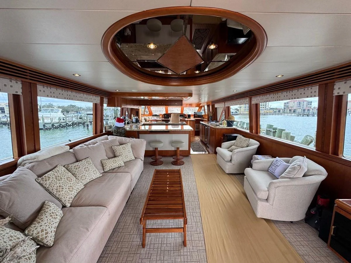 The salon offers a spacious and comfortable lounging area with large windows providing stunning views. aboard 68' HARGRAVE OPEN BRIDGE Yacht for Sale