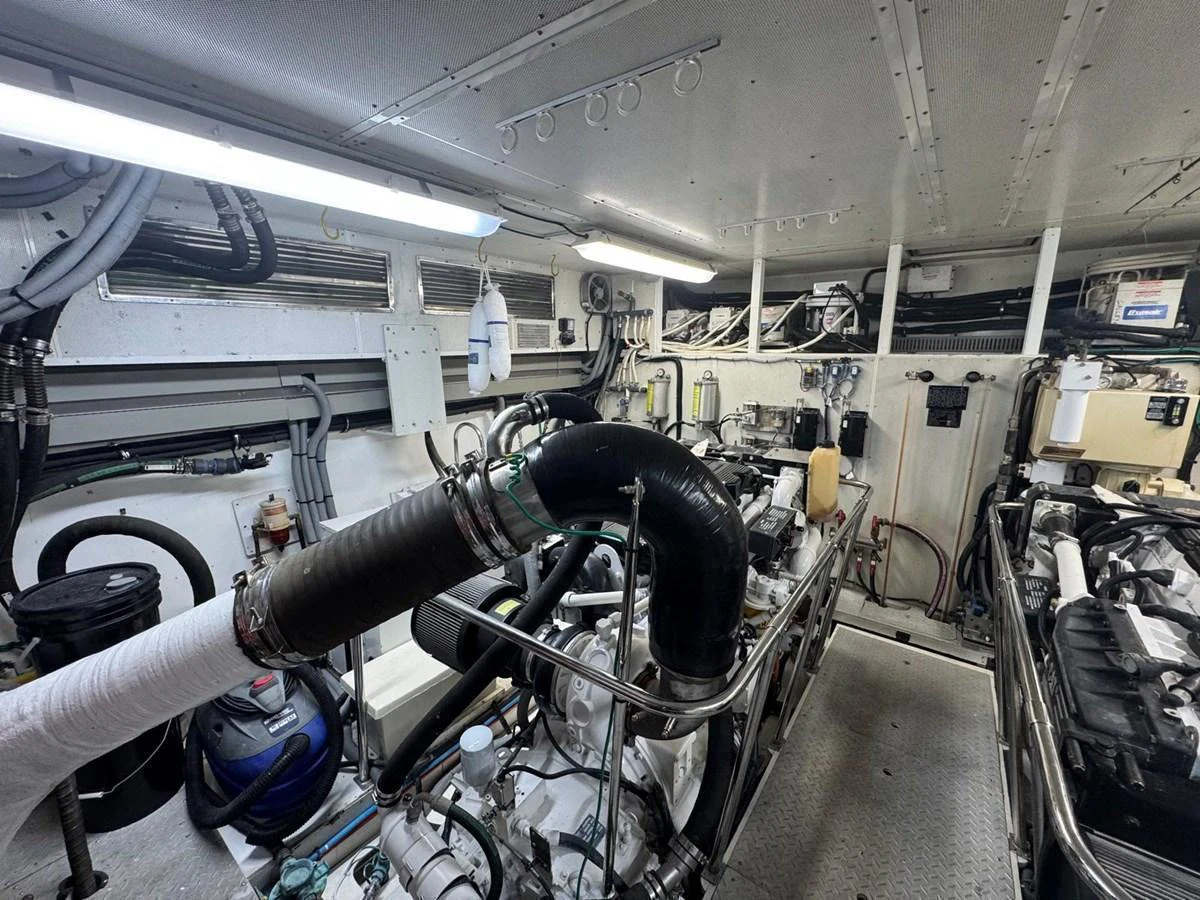 The image showcases the well-maintained engine room of the yacht, highlighting its mechanical components and systems. aboard 68' HARGRAVE OPEN BRIDGE Yacht for Sale