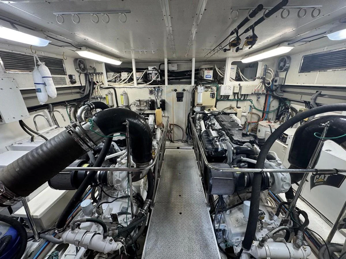 The image showcases the well-maintained engine room of the yacht, highlighting its powerful machinery and organized layout. aboard 68' HARGRAVE OPEN BRIDGE Yacht for Sale