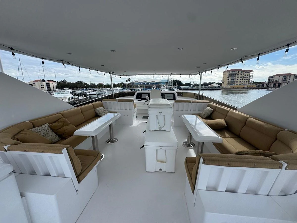The flybridge offers a spacious and comfortable seating area with panoramic views of the marina. aboard 68' HARGRAVE OPEN BRIDGE Yacht for Sale