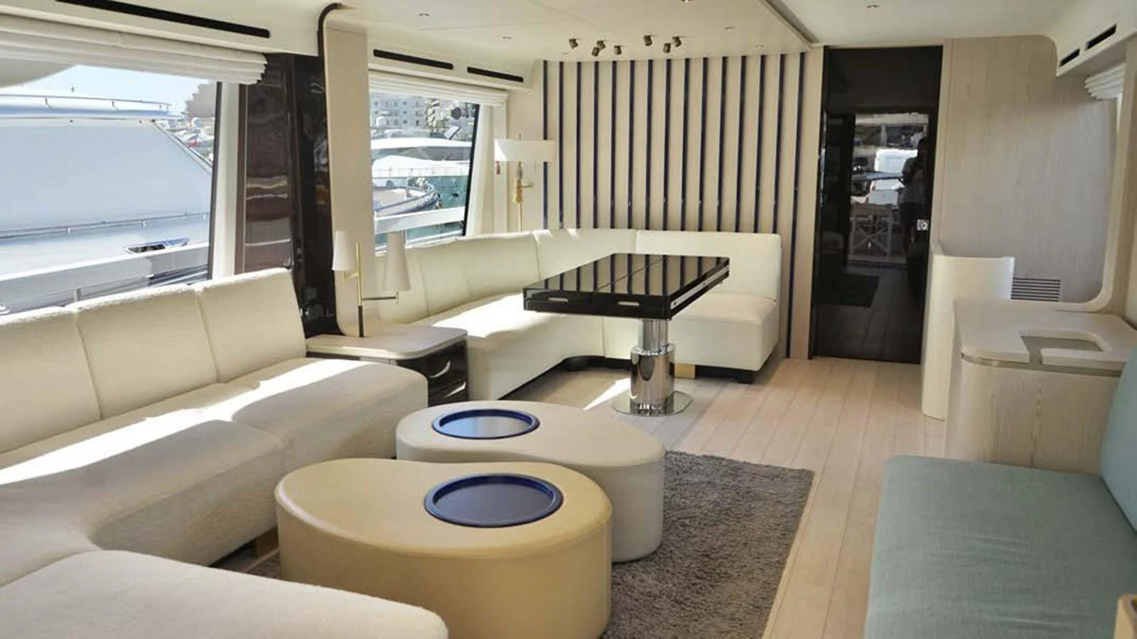 The yacht's salon features a spacious and modern seating area with ample natural light. aboard KOKO Yacht for Sale