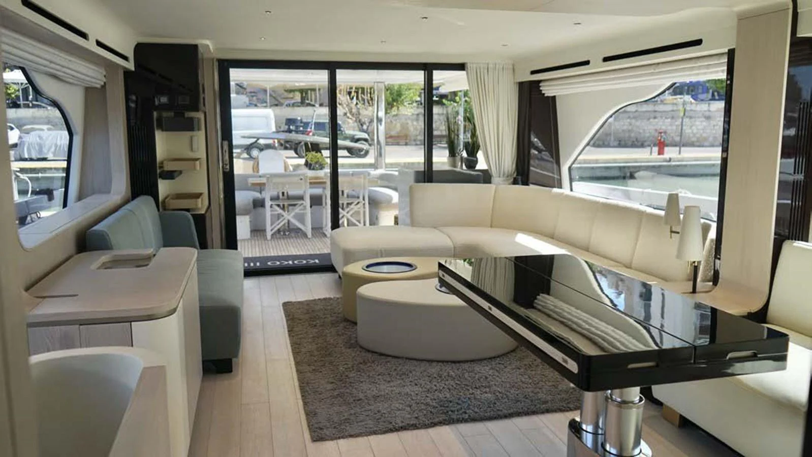 The yacht's salon features a spacious and modern design with ample seating and natural light. aboard KOKO Yacht for Sale
