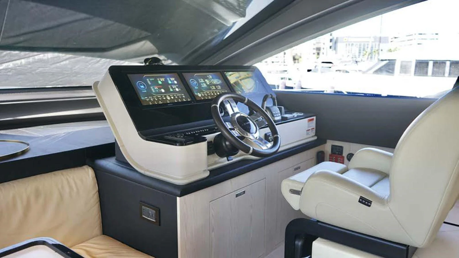 The helm station features modern navigation equipment and a comfortable captain's chair. aboard KOKO Yacht for Sale