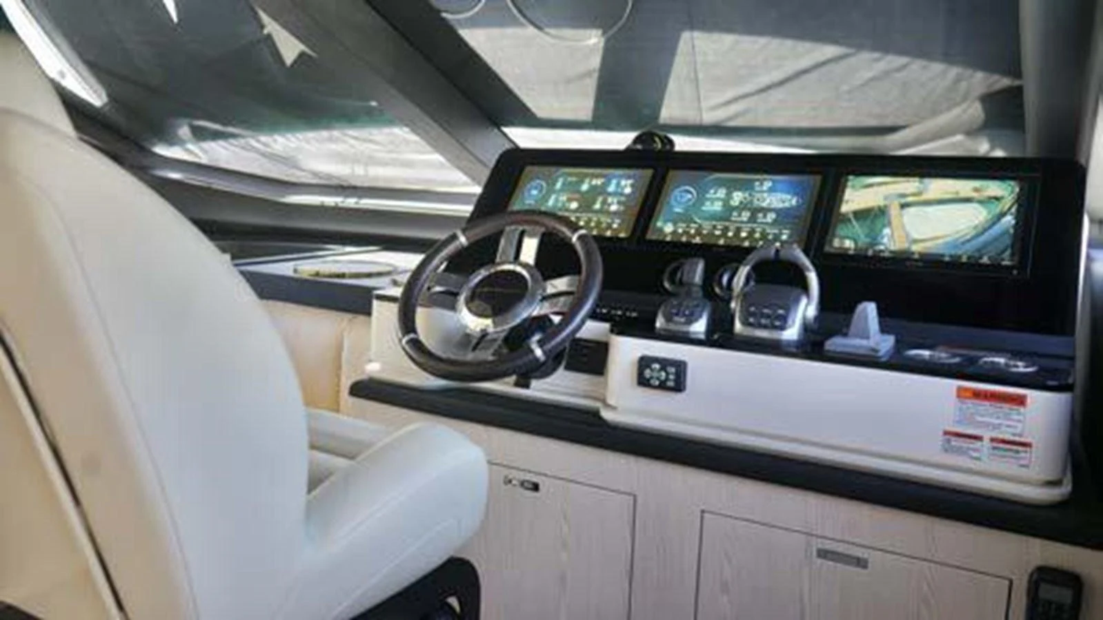 The helm station features advanced navigation systems and a comfortable captain's chair. aboard KOKO Yacht for Sale
