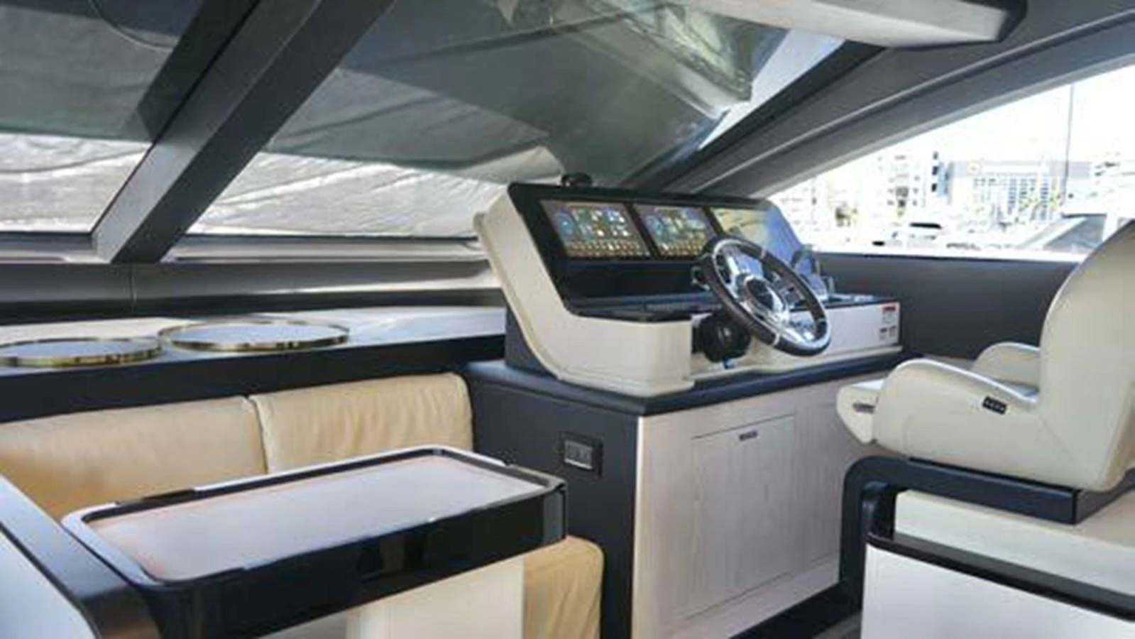 The helm station features modern navigation equipment and comfortable seating. aboard KOKO Yacht for Sale