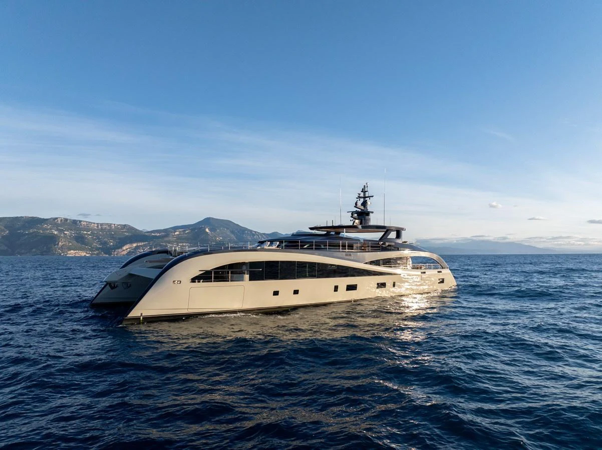 A sleek and modern yacht cruises gracefully on the open sea under a clear blue sky. aboard SEAWOLF X Yacht for Sale