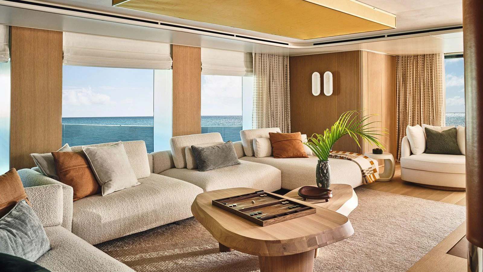 The yacht's salon offers a luxurious and comfortable seating area with panoramic ocean views. aboard SEAWOLF X Yacht for Sale