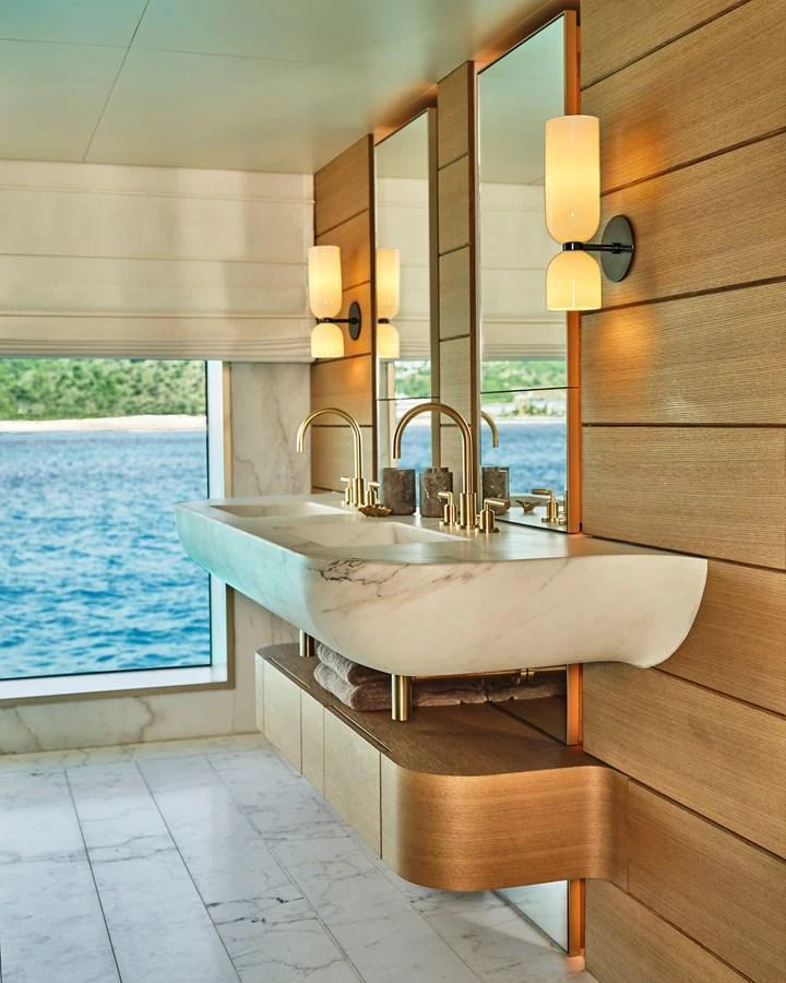 The yacht's bathroom features a luxurious double sink with a stunning ocean view. aboard SEAWOLF X Yacht for Sale