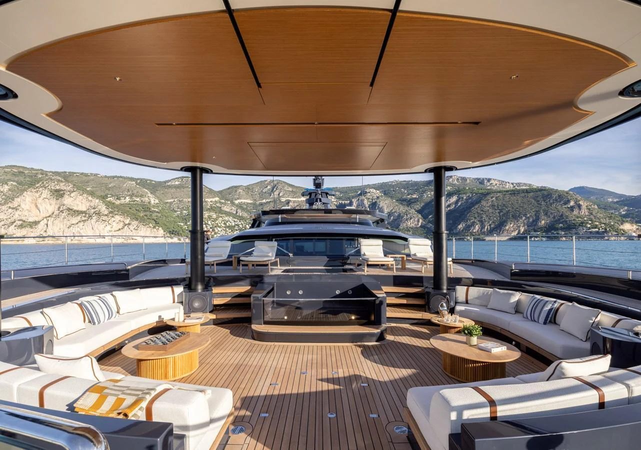 The spacious aft deck offers luxurious seating with stunning views of the surrounding landscape. aboard SEAWOLF X Yacht for Sale